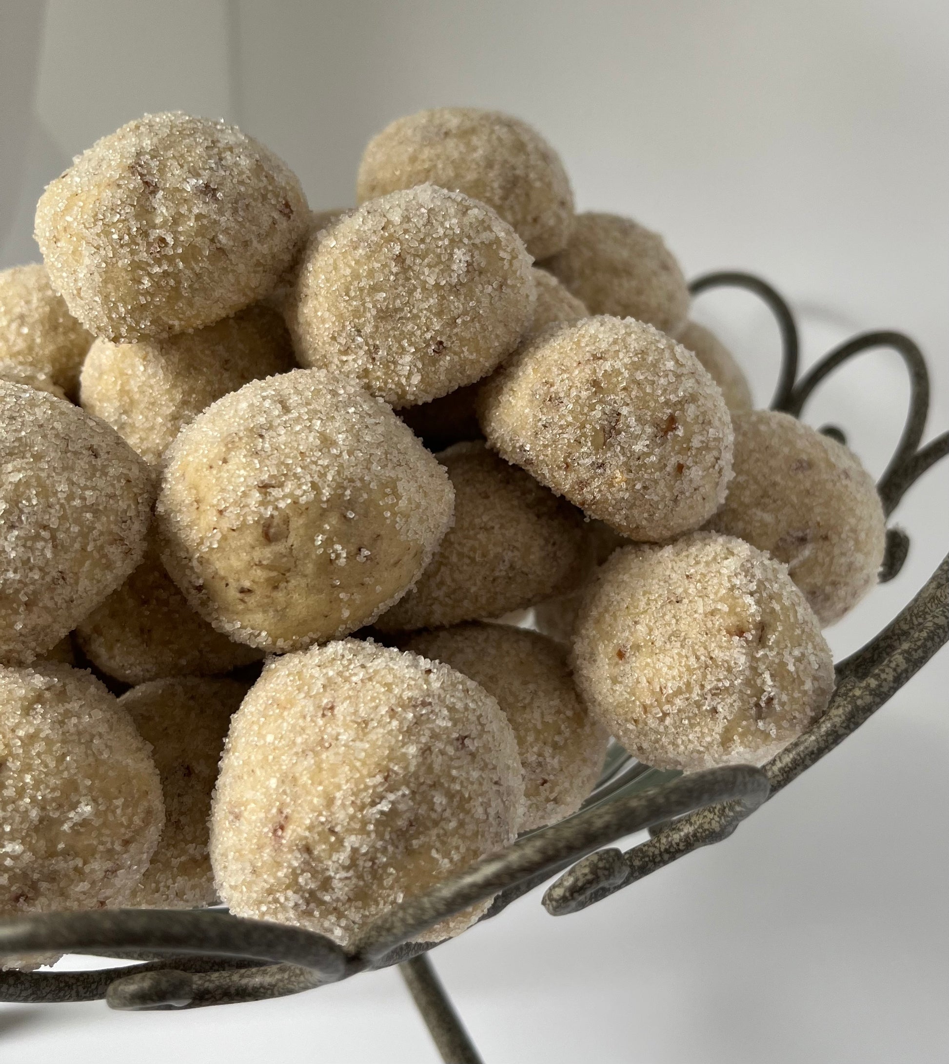 Pecan Premium Fancy Pom-poms. French tea cakes made with French flour, fresh pecans, and creamy butter rolled over fine granulated sugar.